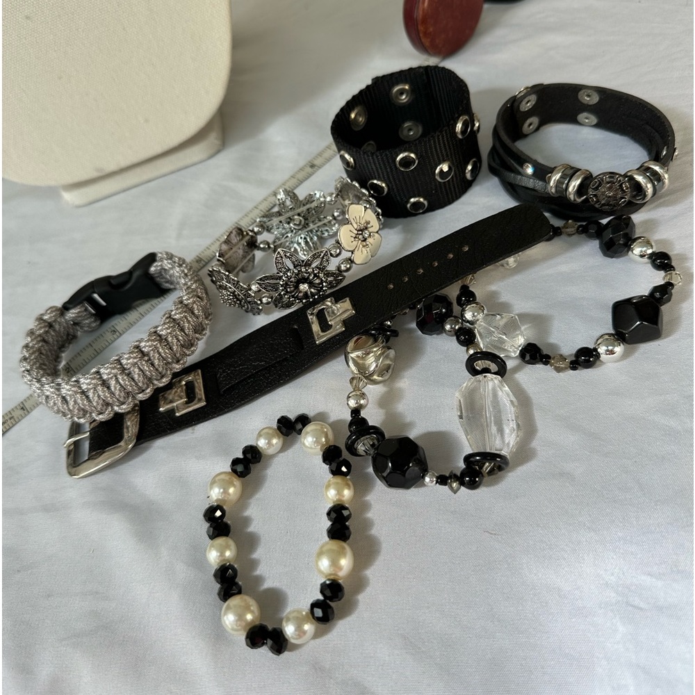 Group of seven black tone bracelets
